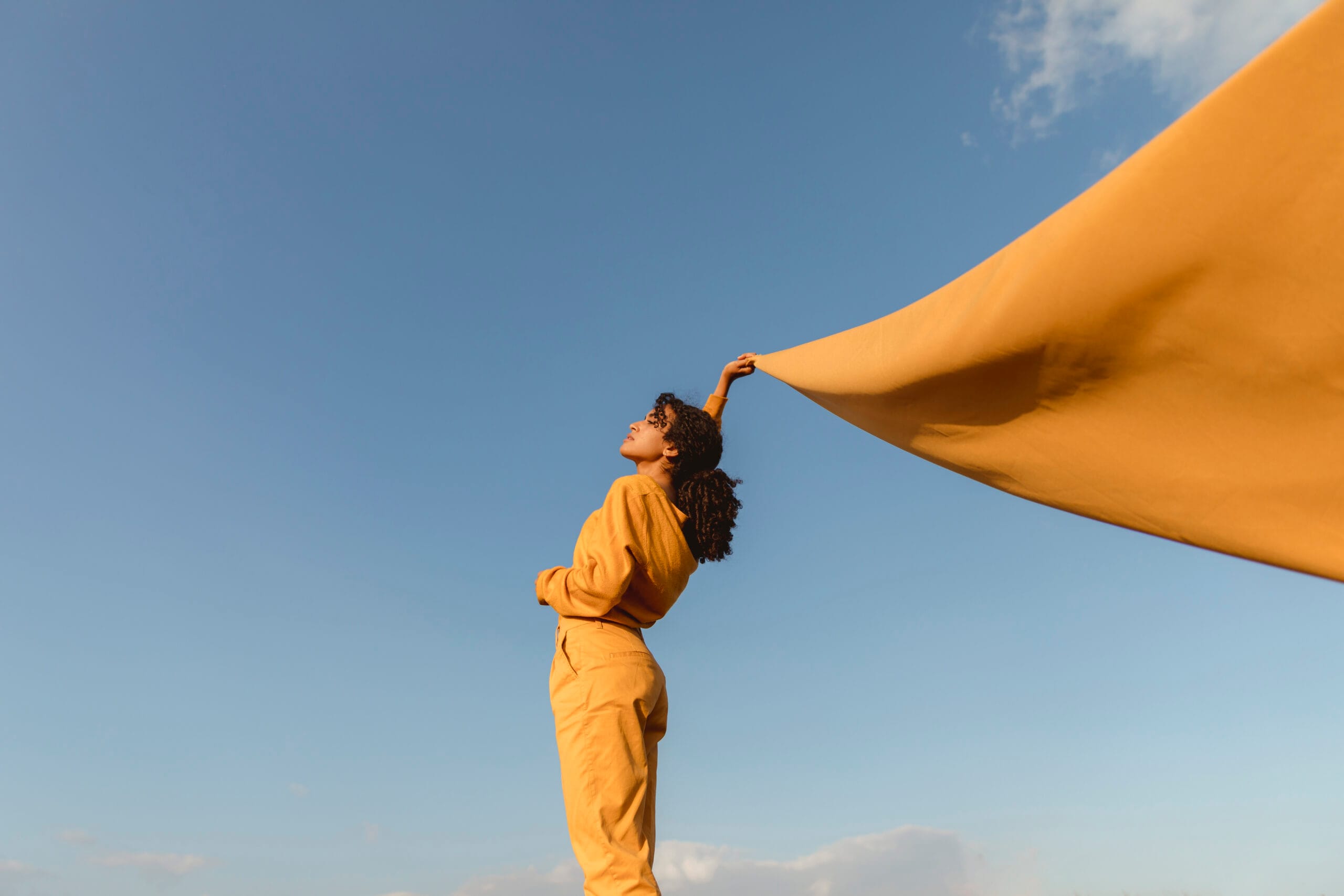 freedom-concept-with-woman-holding-cloth-nature